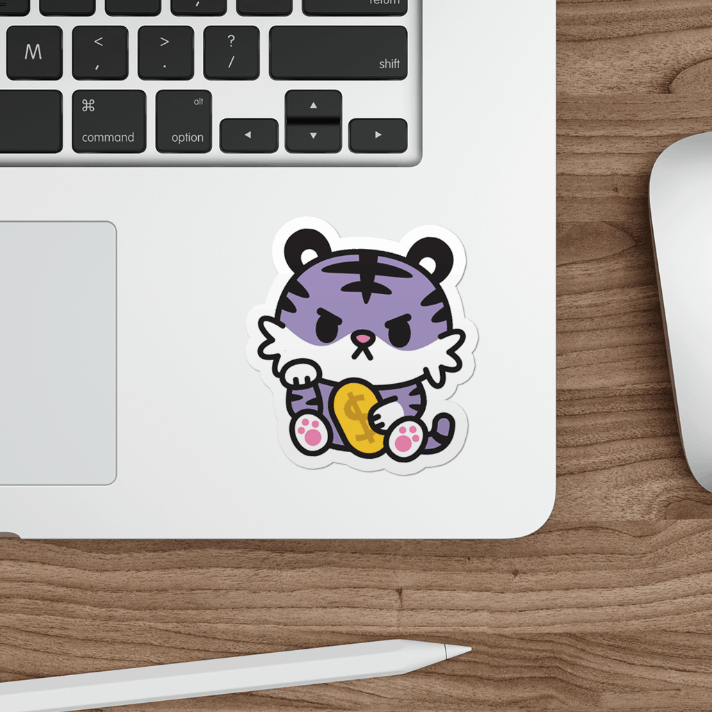 Laptop with a sticker of a cartoon tiger on a wooden desk