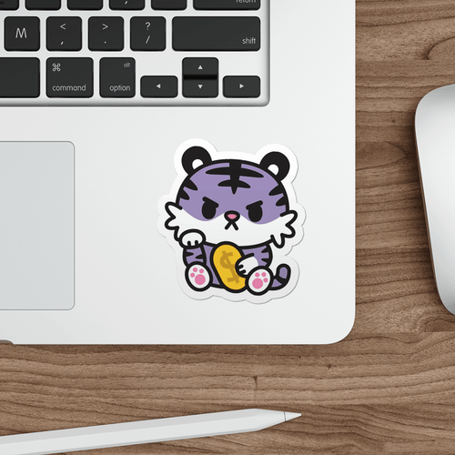 Laptop with a sticker of a cartoon tiger on a wooden desk