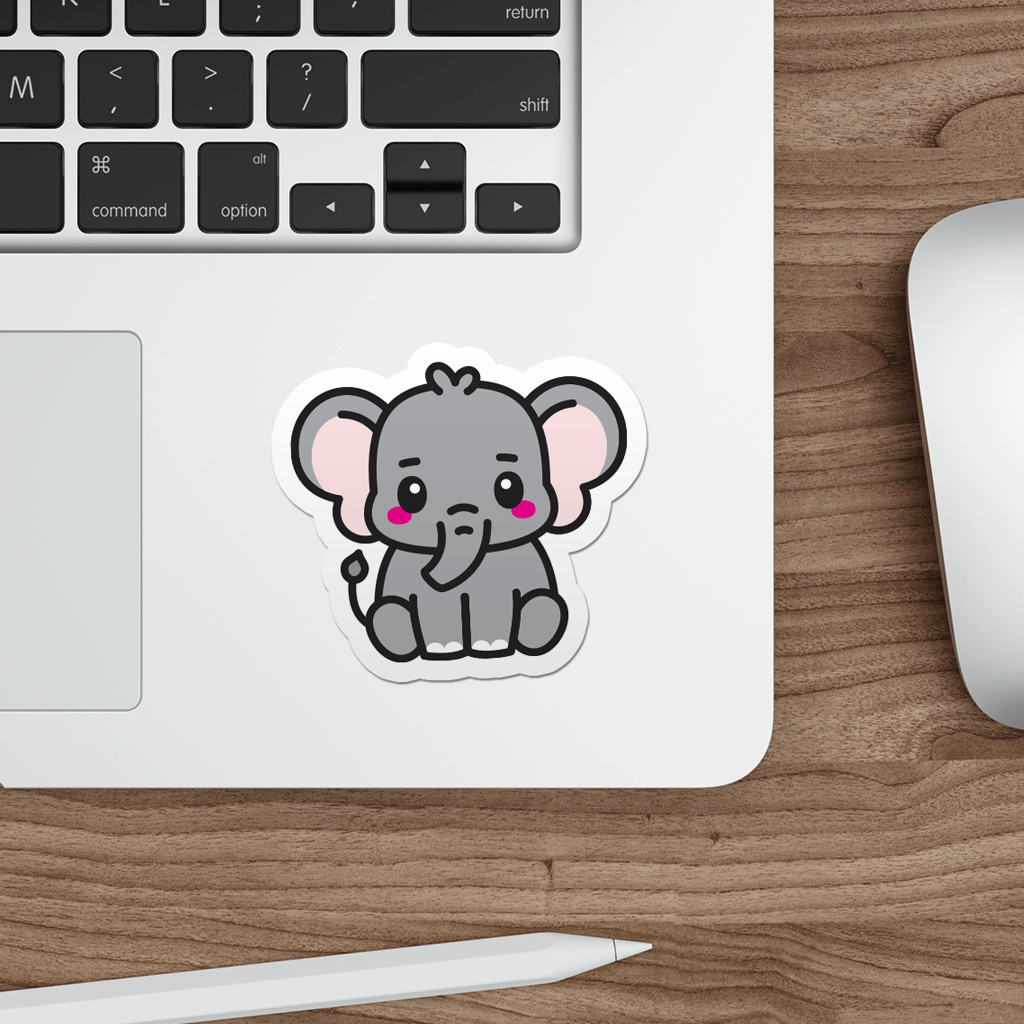 Laptop with a sticker of a cartoon elephant on a wooden desk.