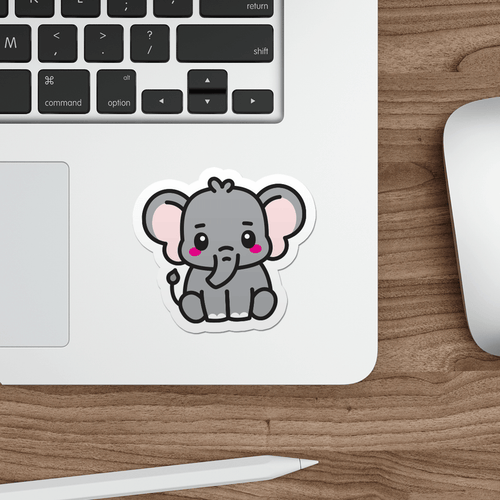 Laptop with a sticker of a cartoon elephant on a wooden desk.