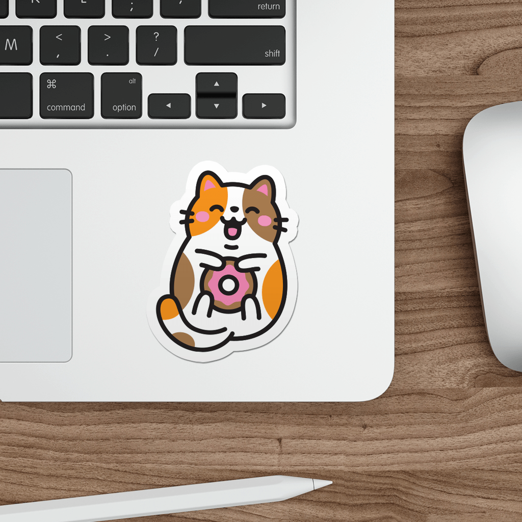Laptop with a sticker of a cat holding a donut on a wooden desk.