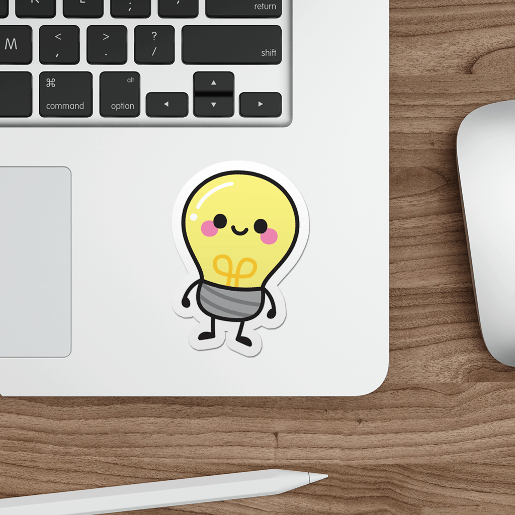 Laptop with a cute light bulb sticker on a wooden desk