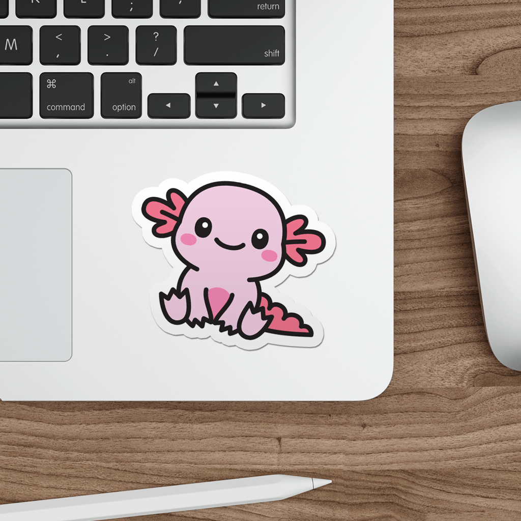 Laptop with a sticker of a kawaii pink axolotl on a wooden desk.