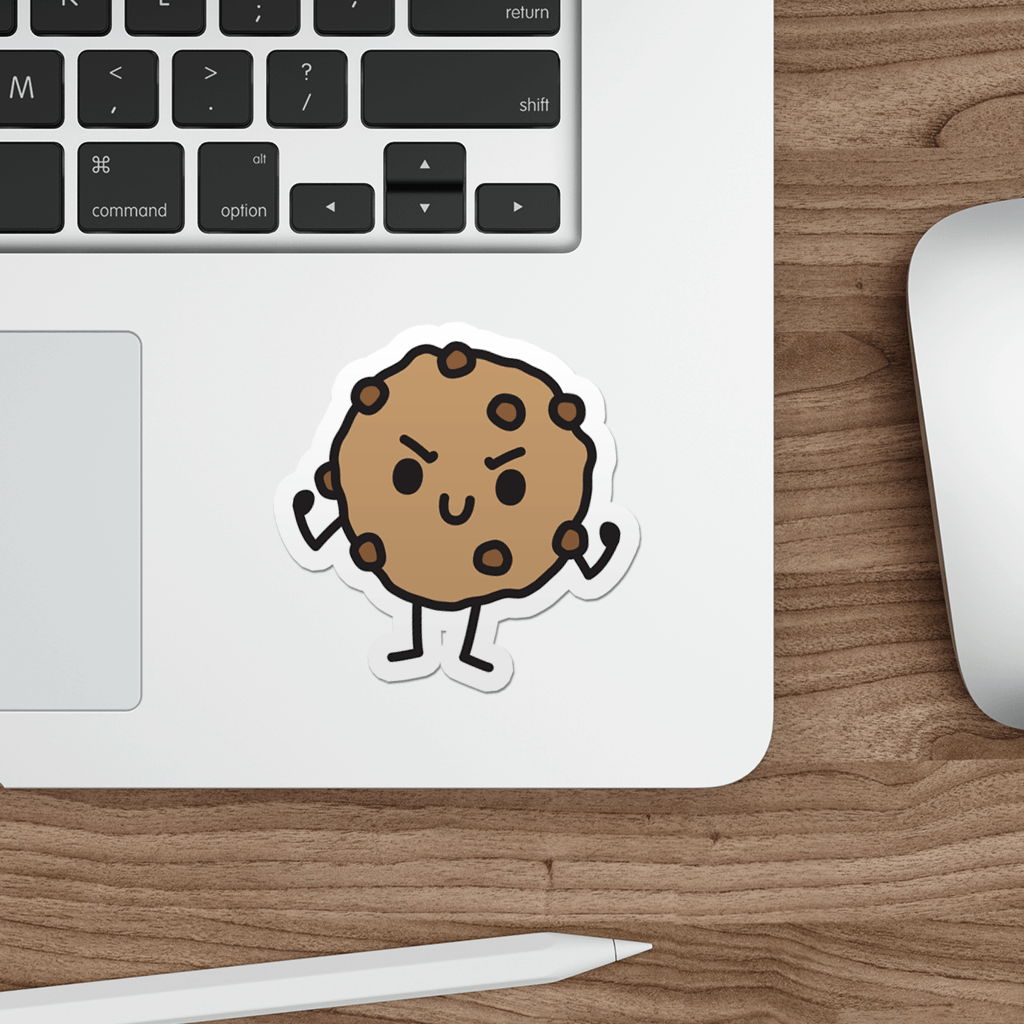 Laptop with a die-cut vinyl sticker of a cute tough cookie on a wooden desk.