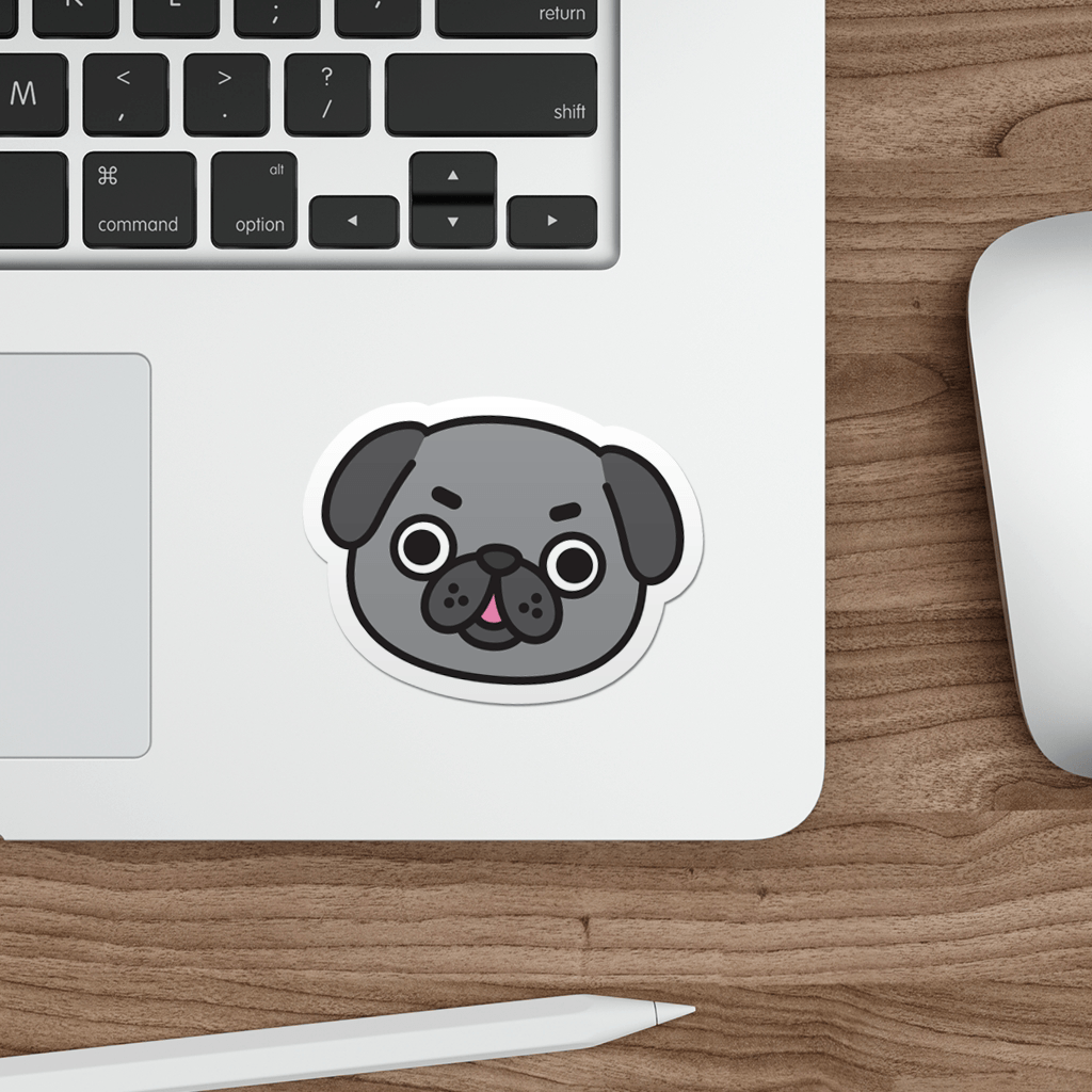 Laptop with a sticker of a pug's face on a wooden desk.