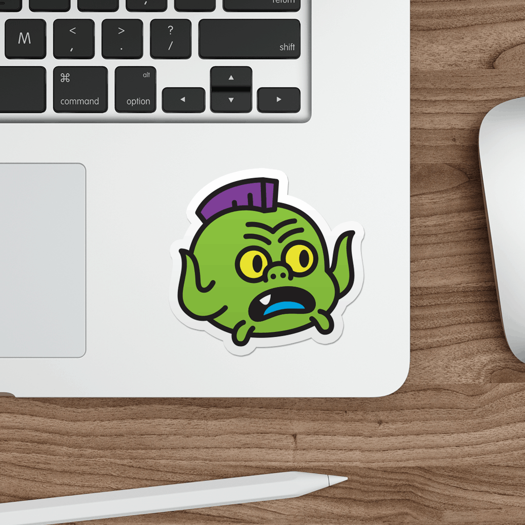 Laptop with a sticker of a cartoon ninja turtle on a wooden desk.