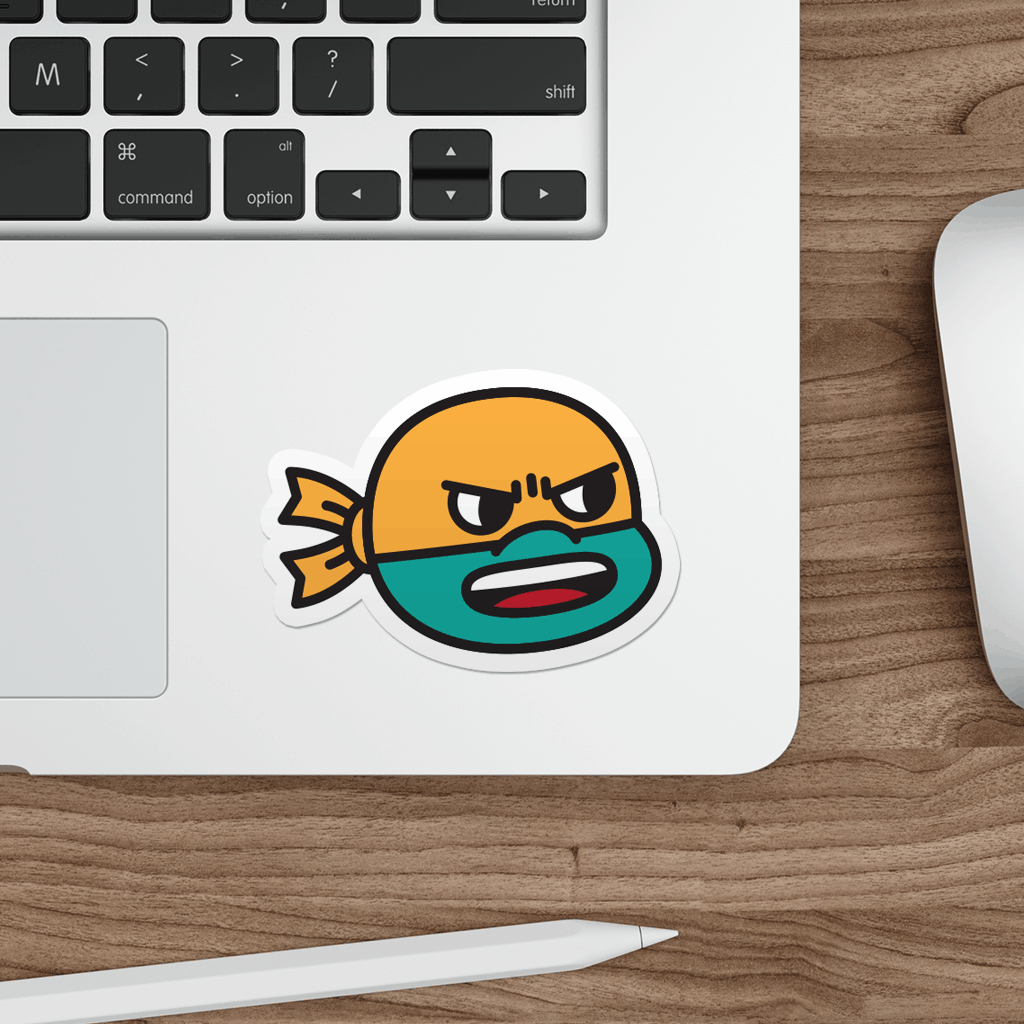 Laptop with a sticker of a cartoon ninja turtle on a wooden desk.