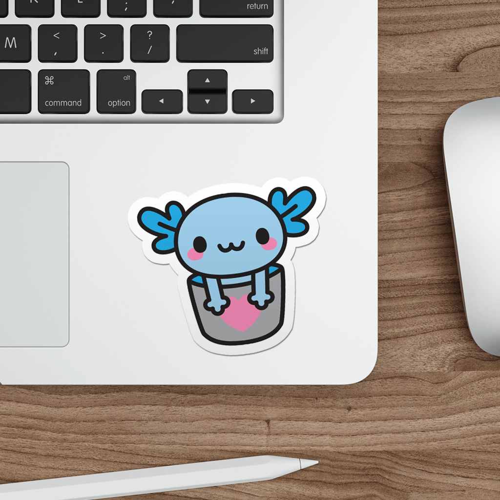Laptop with a sticker of a kawaii bucket of blue axolotl a wooden desk.