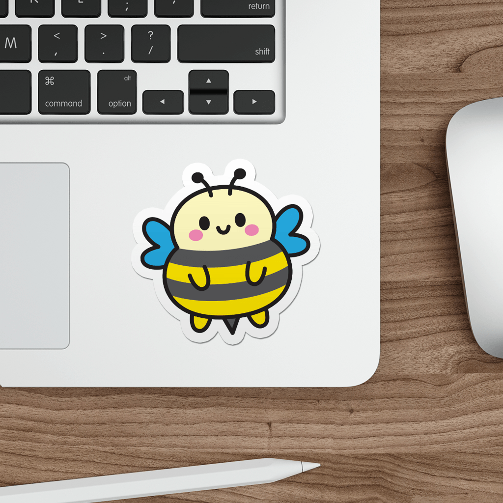 Laptop with a cartoon bee sticker on a wooden desk