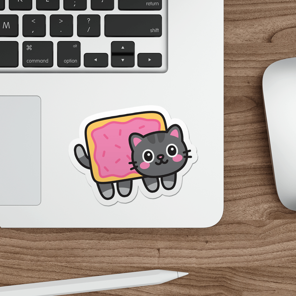 Laptop with a sticker of a kawaii nyan cat on a wooden desk.